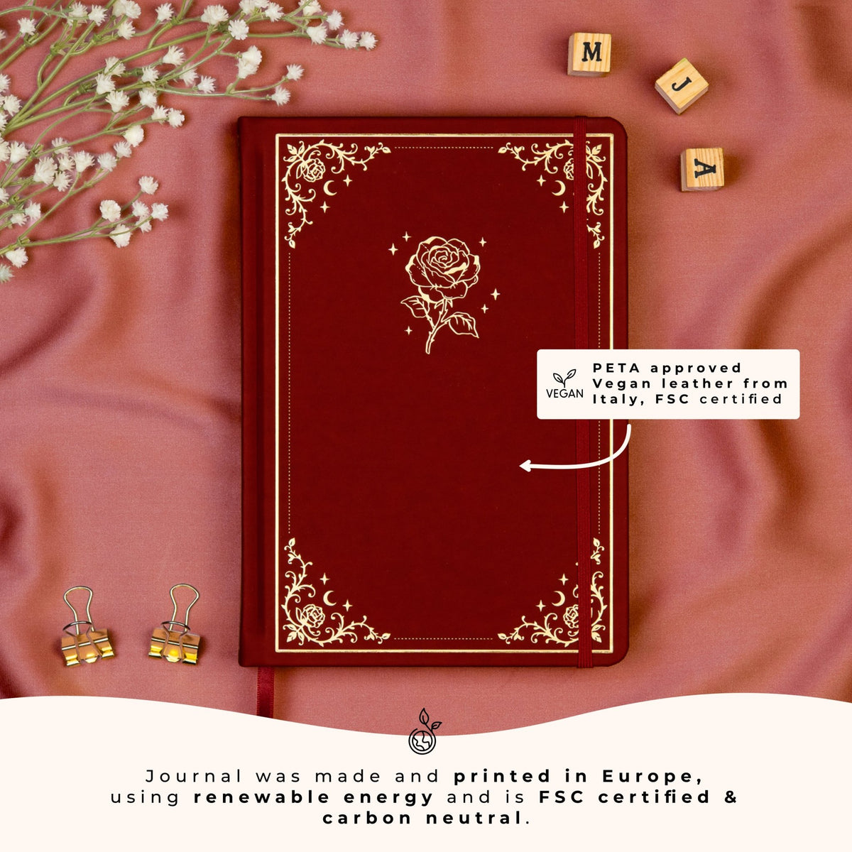Deep red A5 dotted premade bullet style journal made of PETA approved vegan leather, featuring FSC and carbon-neutral certifications, sustainably made in Europe.