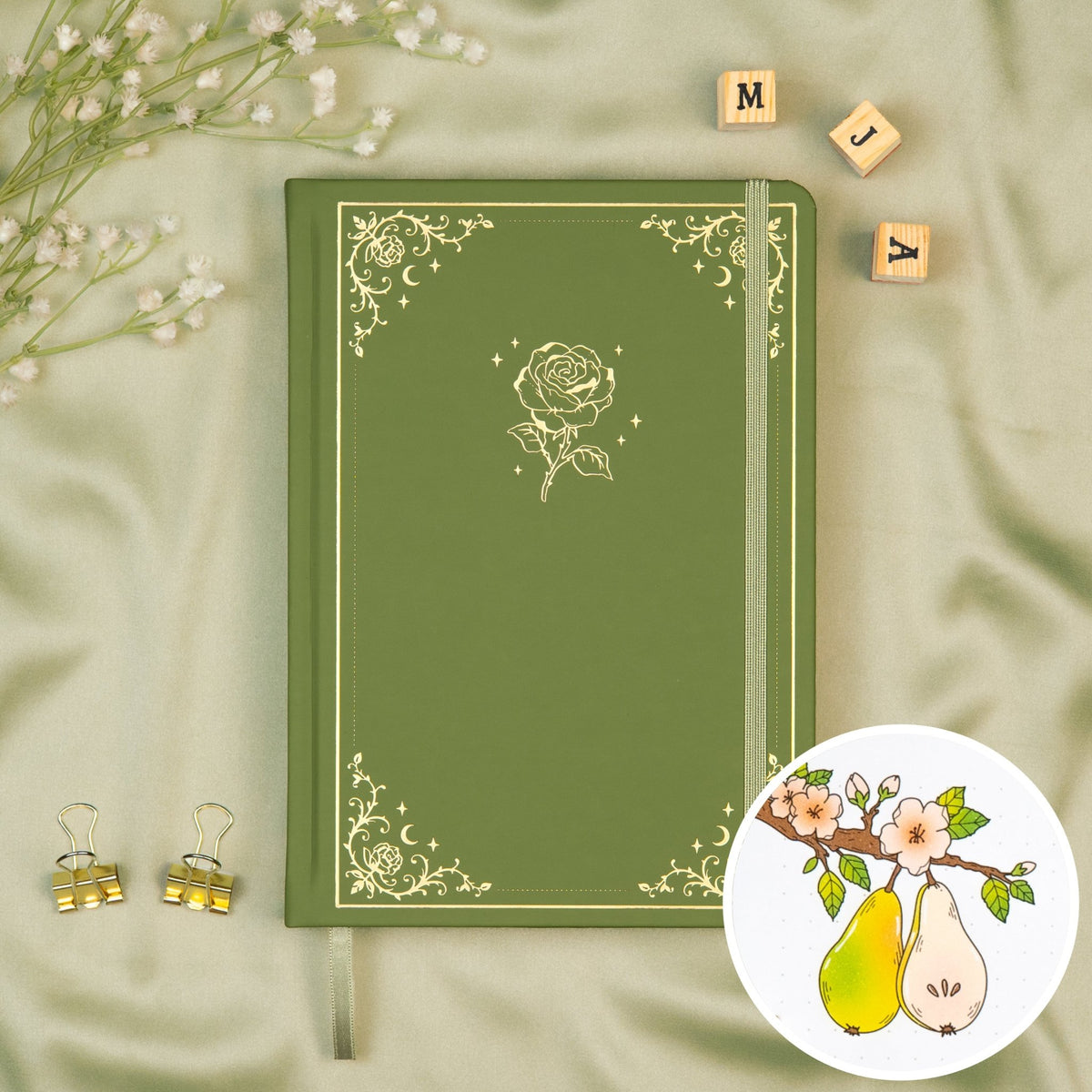 Sage colored Premade bullet style journal made of Italian vegan leather with an embossed gold rose design.
