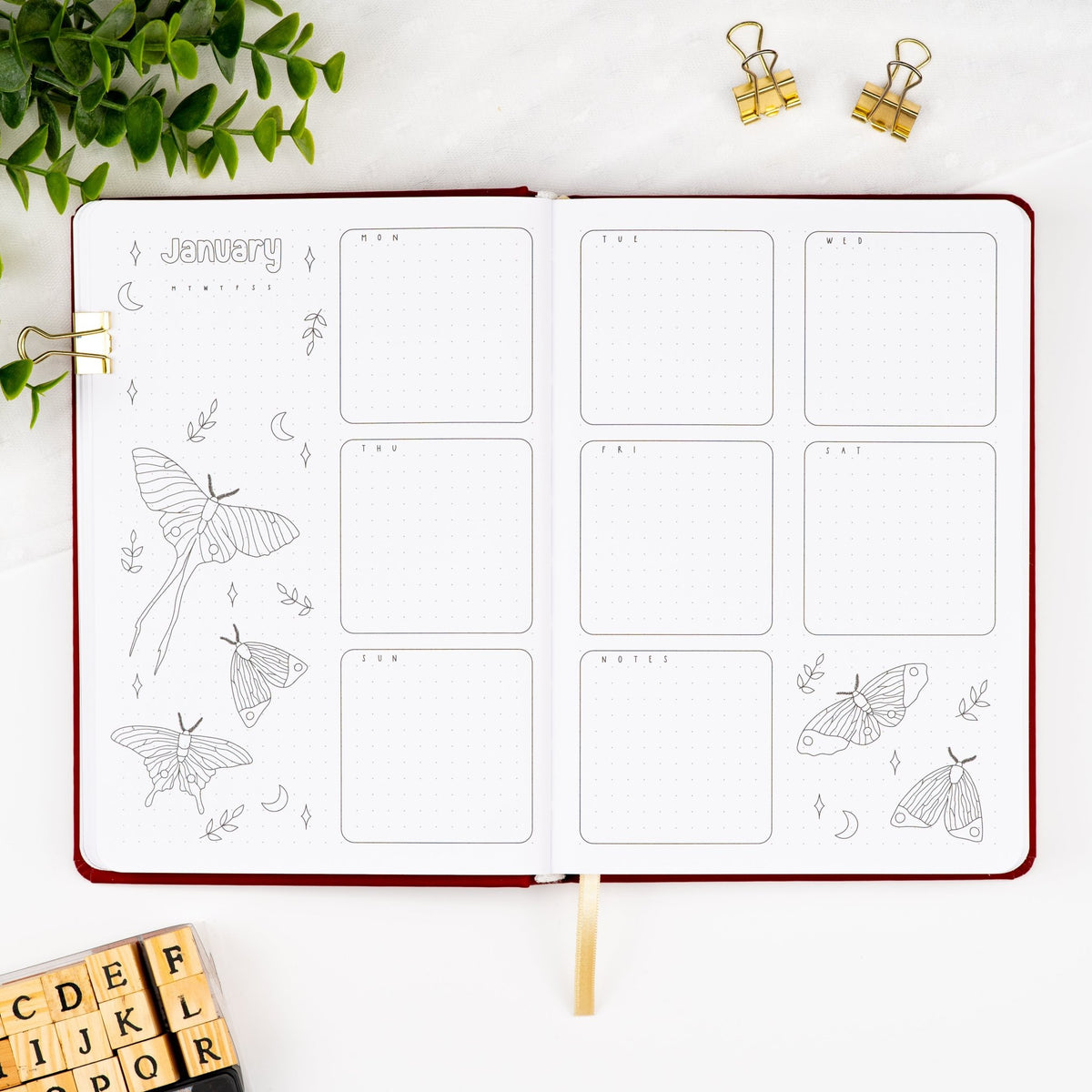 Fourth monthly weekly layout of a premade journal with calligraphy January title, calendar, days and notes section.
