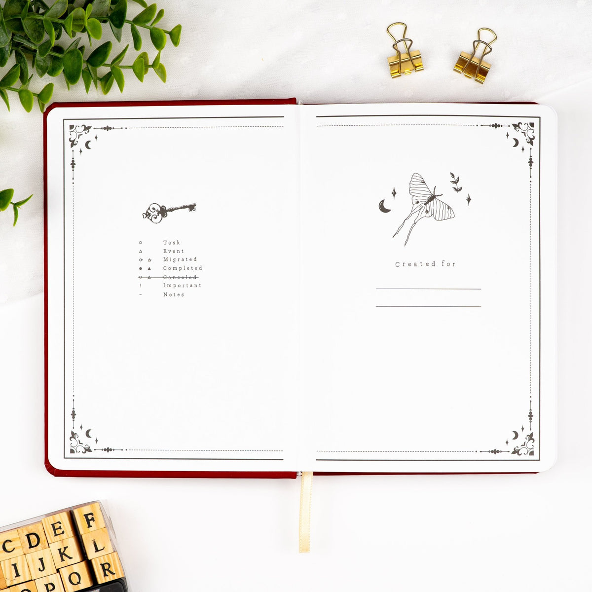First pages of an opened premade journal, featuring a legend and a designated space for writing your name.