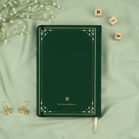 Vegan leather back cover of the Poison Ivy deep green premade bullet style journal with embossed gold logo detail.