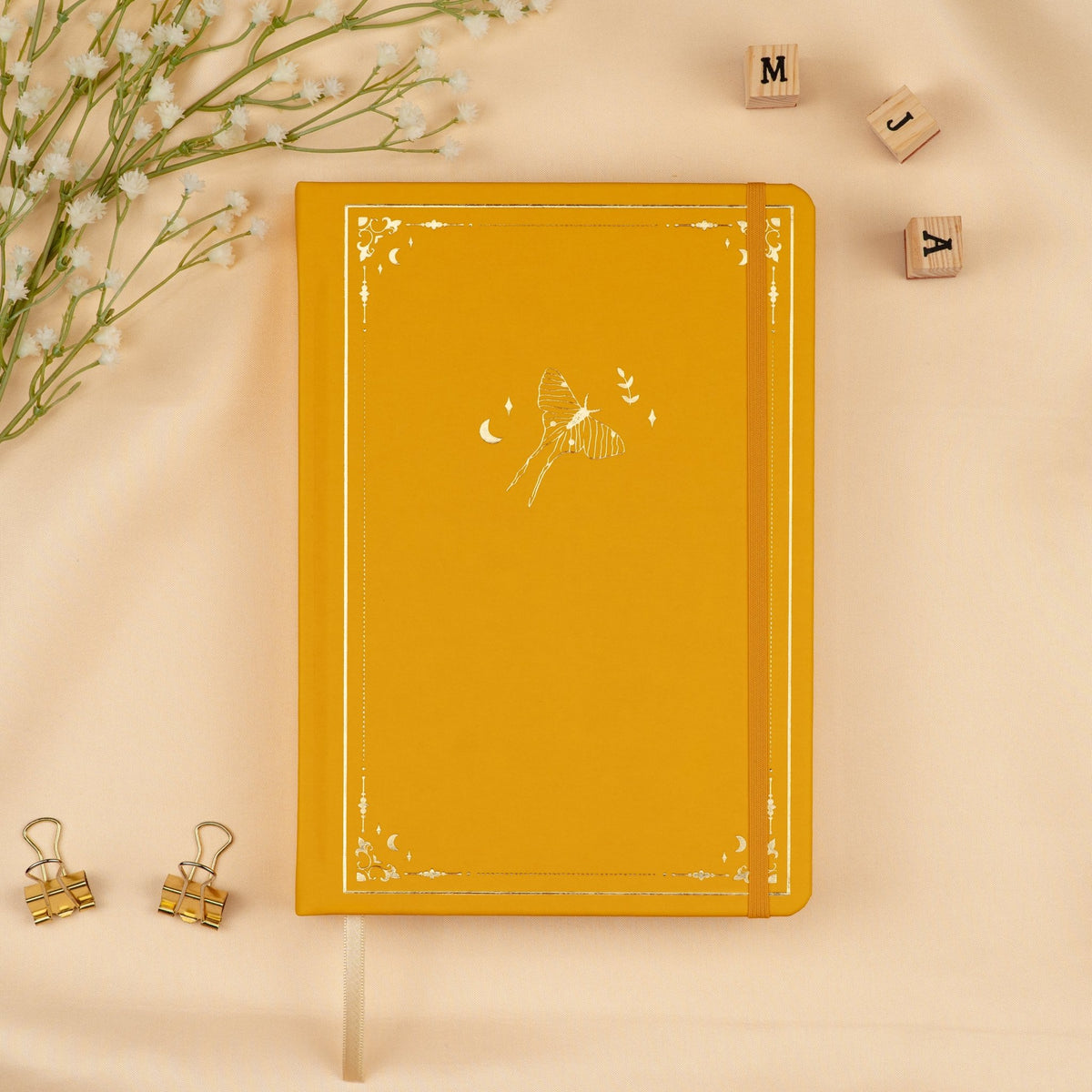 Yellow Honey Spice premade dotted bullet style journal made of Italian vegan leather with an embossed gold Luna Moth design.