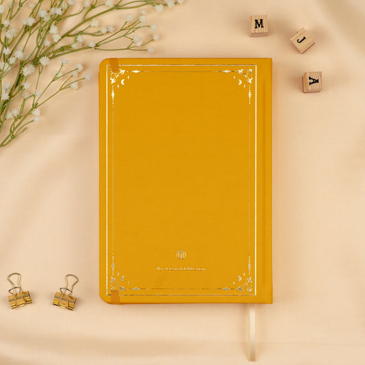 Vegan leather back cover of the Yellow Honey Spice premade bullet style journal with embossed gold logo detail.