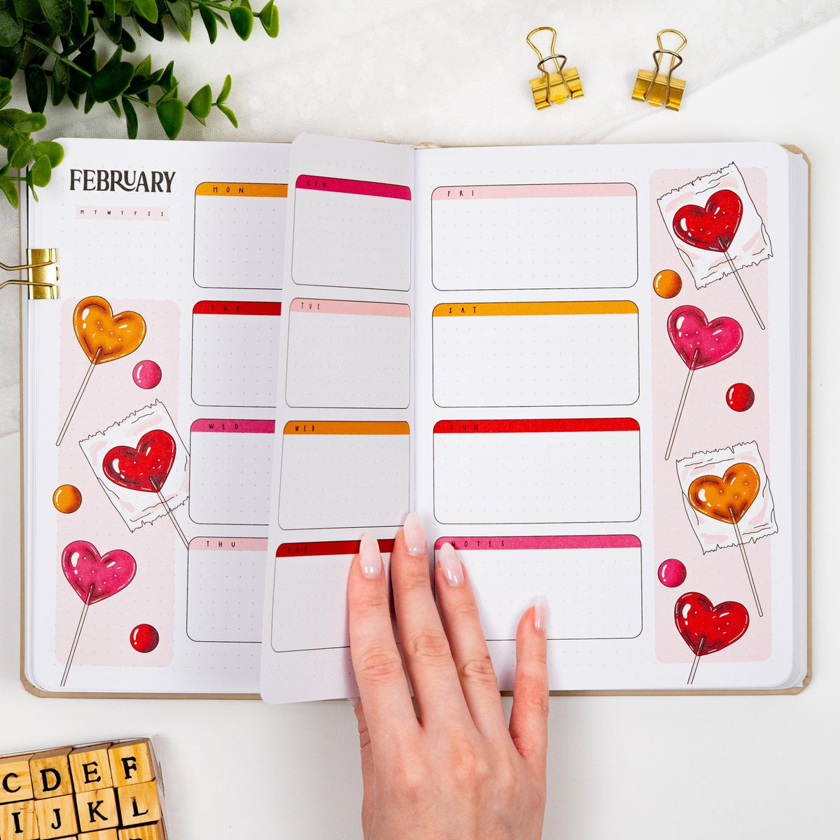 Second and third monthly weekly layout of a colored premade journal designed for Dutch door setup with calligraphy February title, calendar, days and notes section.