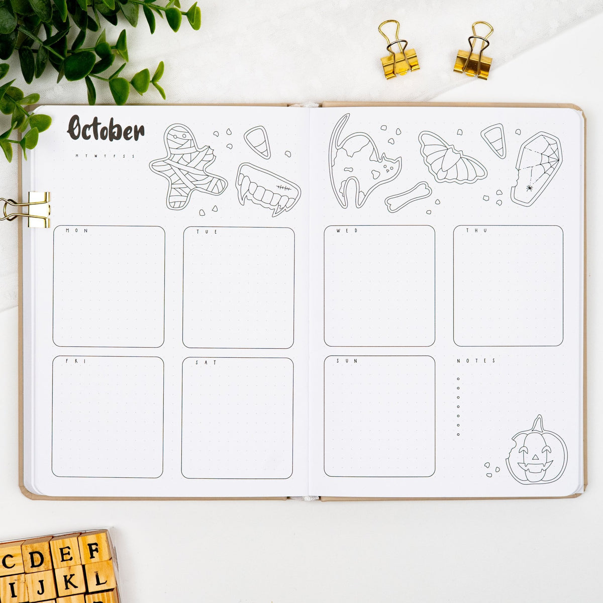 First monthly weekly layout of a premade journal, with calligraphy October title, calendar, days and notes section.