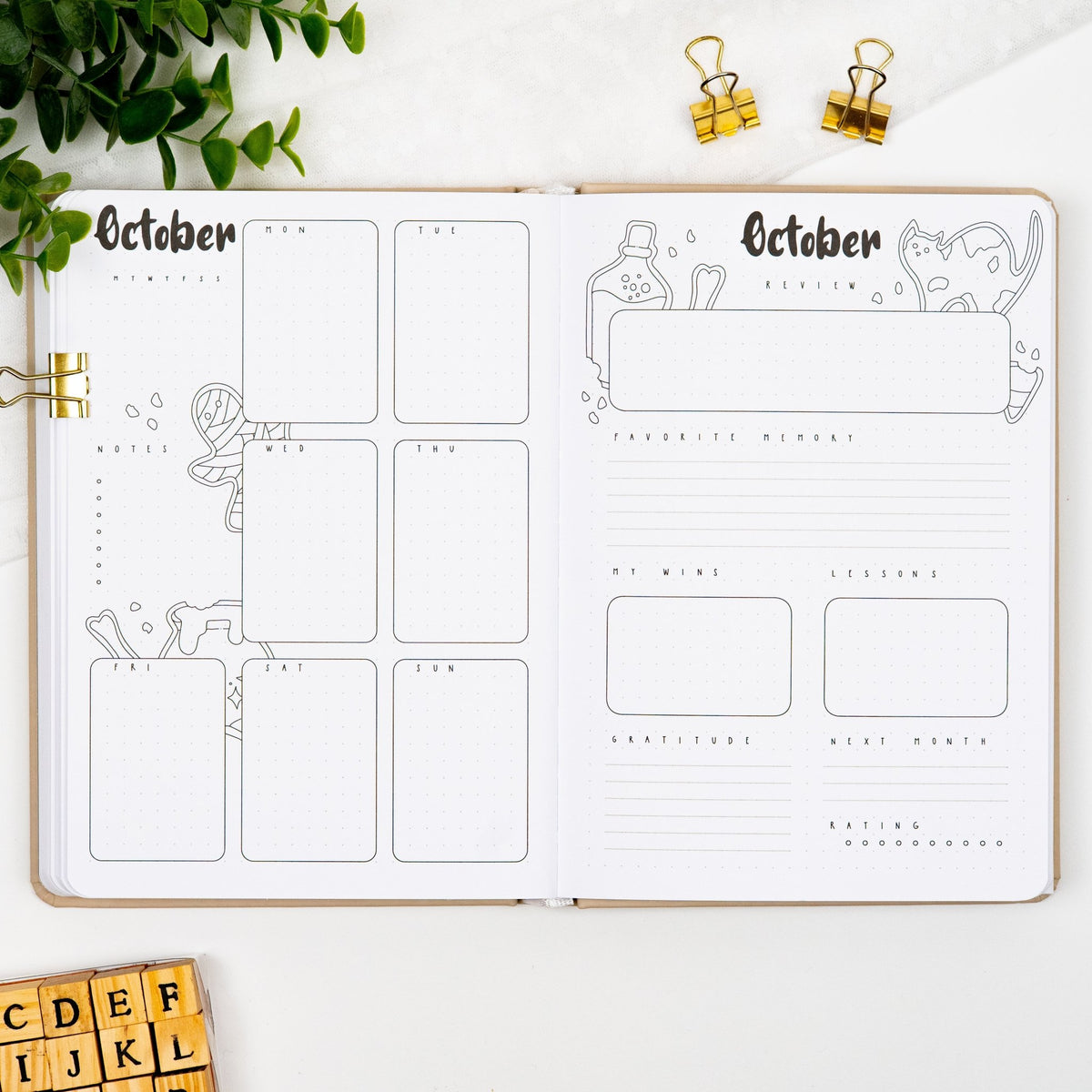 Fifth monthly weekly layout of a premade journal with calligraphy October title, calendar, days and notes section and a monthly review page.