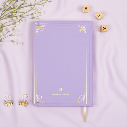 Vegan leather back cover of the light purple Lavender premade bullet style journal with embossed gold logo detail.