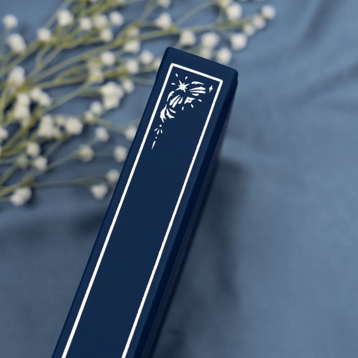 Showing the embossed silver detail on the spine of the Midnight blue premade bullet style journal.