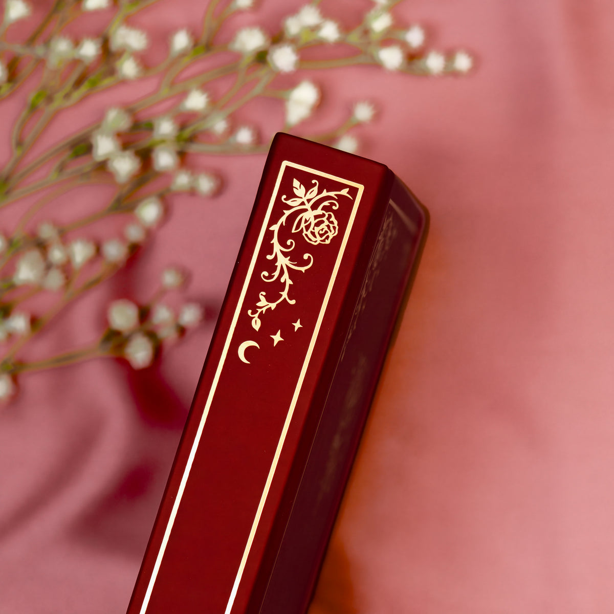 Embossed gold detail on the spine of the Burgundy premade bullet style journal.
