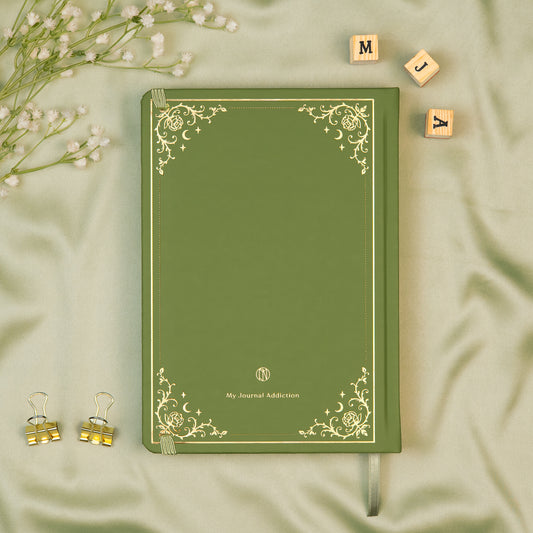 Vegan leather back cover of the Sage premade bullet style journal with embossed gold logo detail.