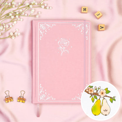 Pink colored Premade bullet style journal made of Italian vegan leather with an embossed gold rose design.