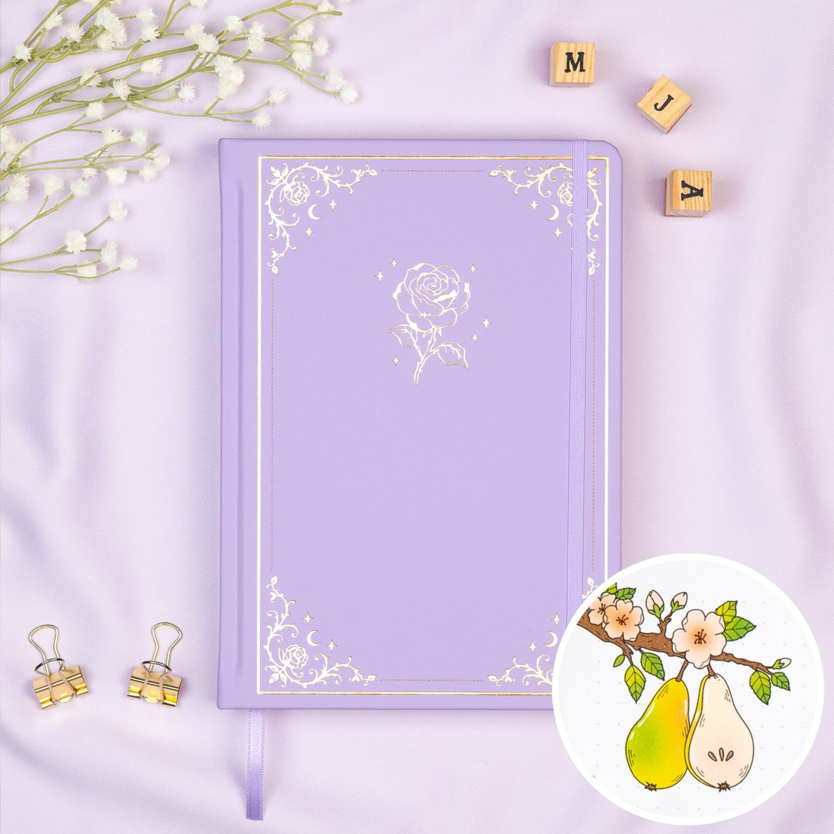 Lavender colored Premade bullet style journal made of Italian vegan leather with an embossed gold rose design.