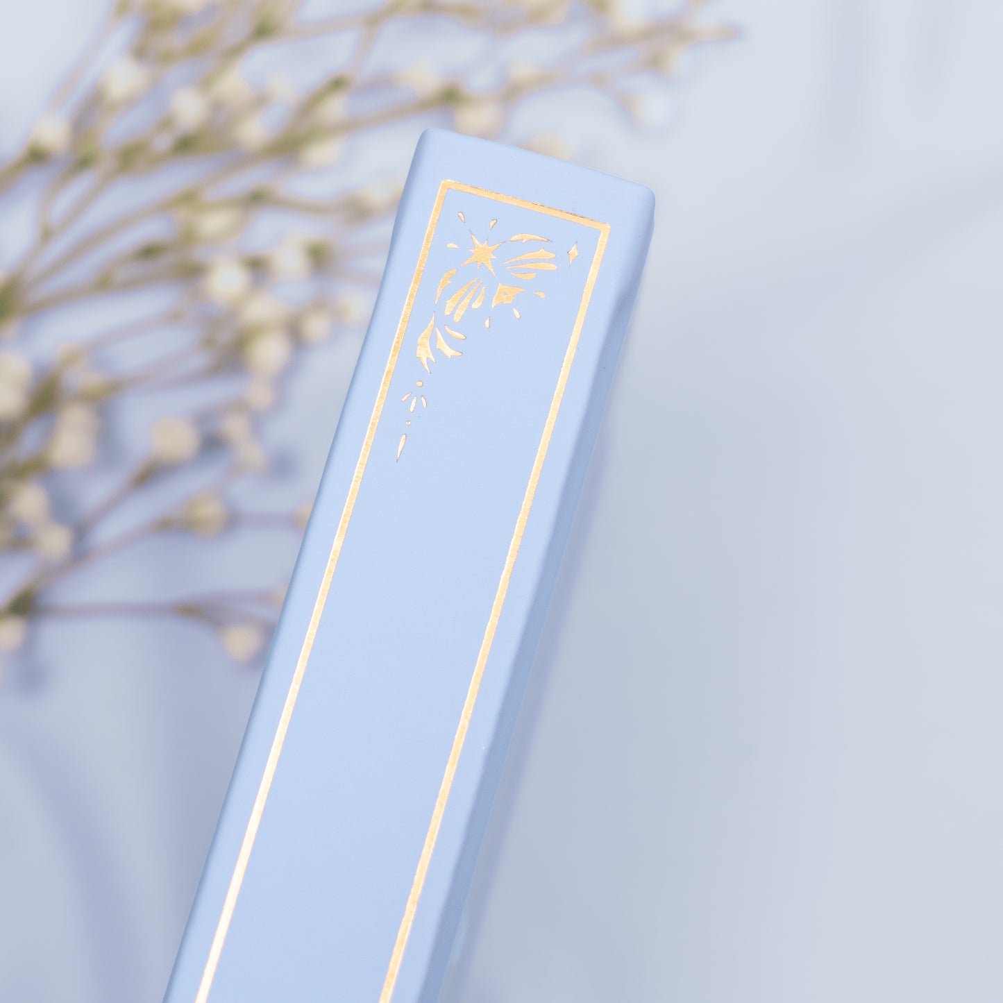 Showing the embossed gold detail on the spine of the Cloud premade bullet style journal.