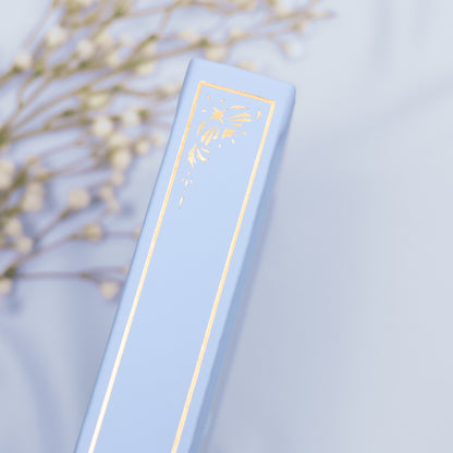 Showing the embossed gold detail on the spine of the Cloud premade bullet style journal.