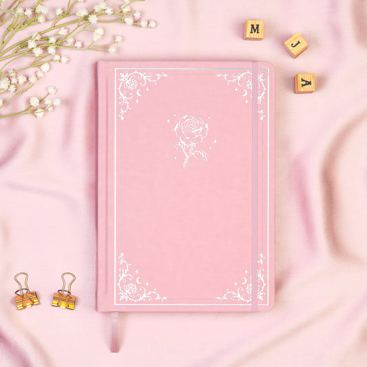 Pink Premade bullet style journal made of Italian vegan leather with an embossed gold rose design.