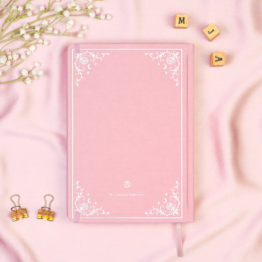 Vegan leather back cover of the Pink premade bullet style journal with embossed gold logo detail. 