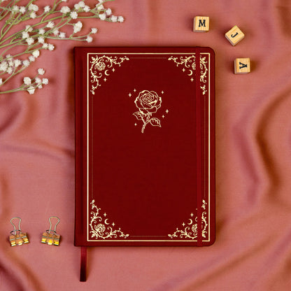 Burgundy Premade bullet style journal made of Italian vegan leather with an embossed gold rose design.