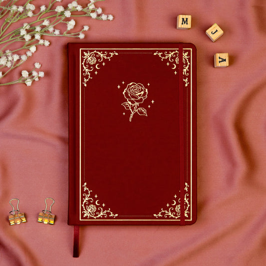 Burgundy Premade bullet style journal made of Italian vegan leather with an embossed gold rose design.