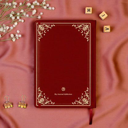 Vegan leather back cover of the Burgundy premade bullet style journal with embossed gold logo detail. 