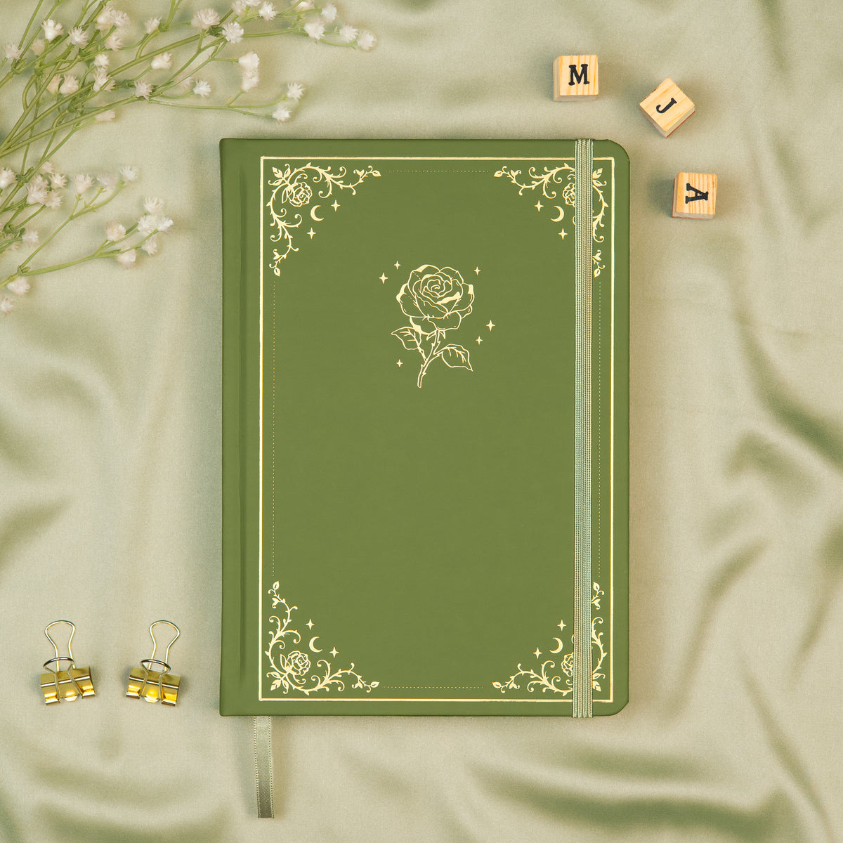 Sage Premade bullet style journal made of Italian vegan leather with an embossed gold rose design.