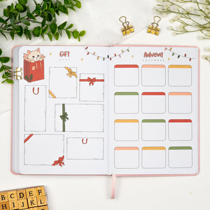 An opened colorful premade planner on a gift list planner and advent calendar page