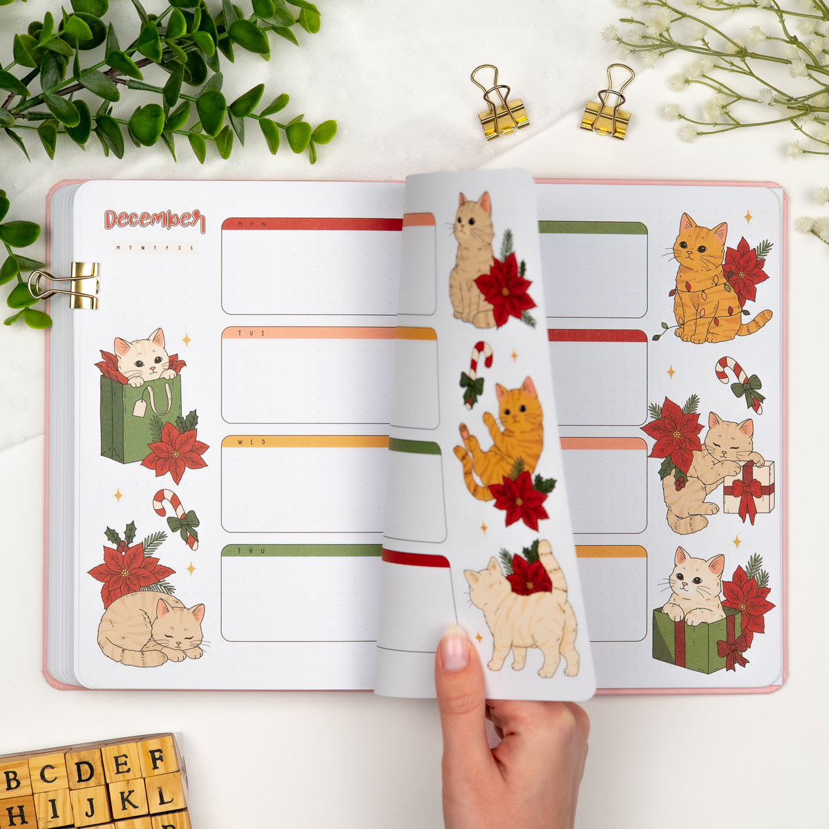 Second and third monthly weekly layout of a premade journal designed for Dutch door setup with calligraphy monthly title, calendar, days and cute illustrations of cats in christmas mood.