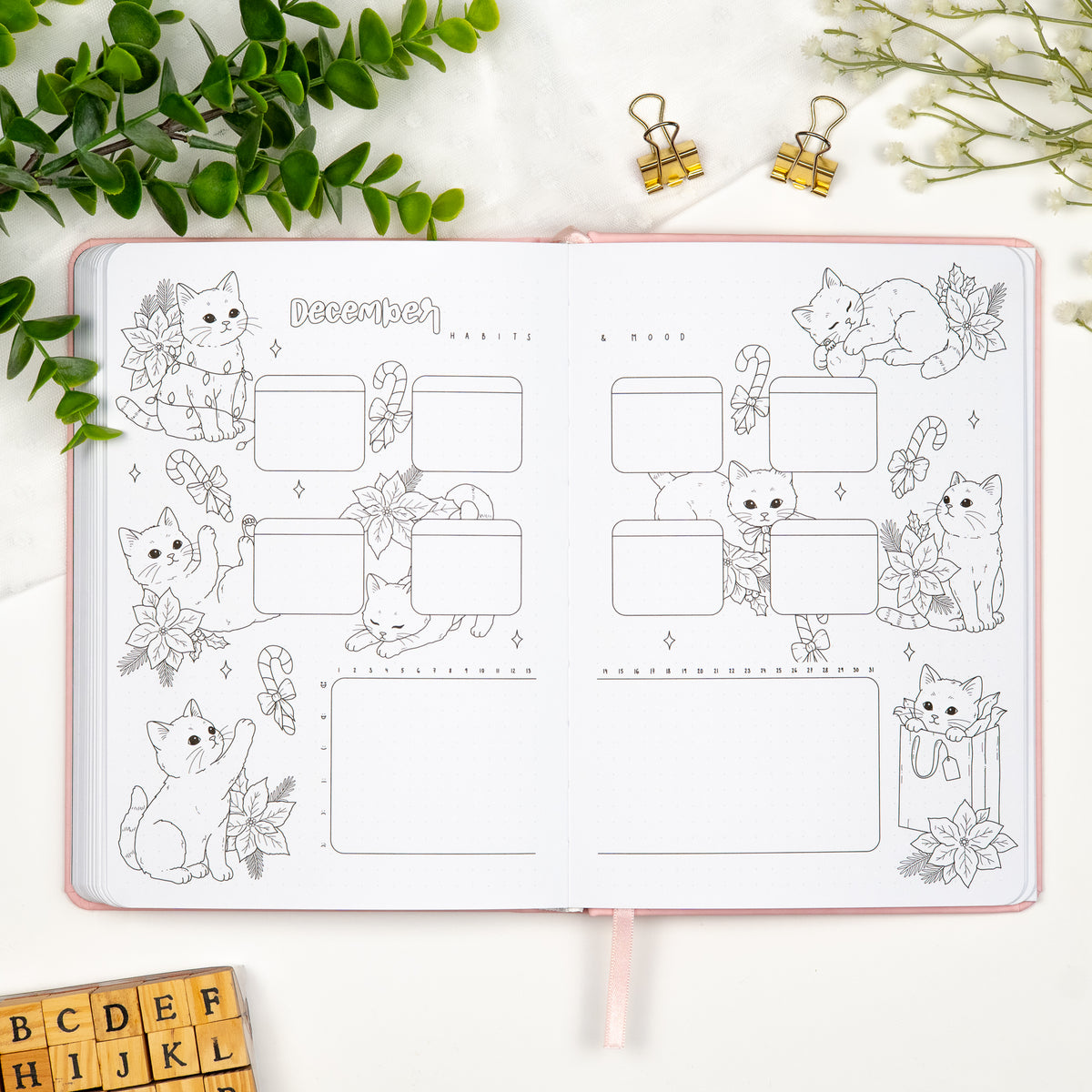 December habits and mood tracker spread with illustrations of cats in christmas mood.