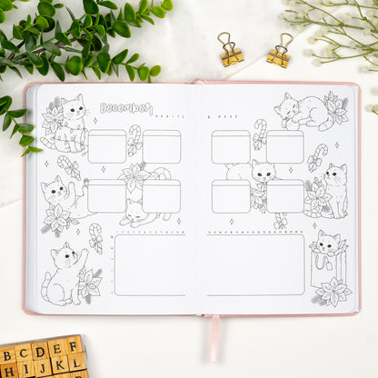 December habits and mood tracker spread with illustrations of cats in christmas mood.