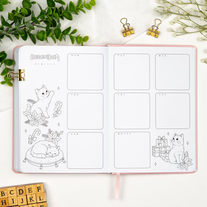 Fourth monthly weekly layout of a premade journal with calligraphy title, calendar, days and notes section.